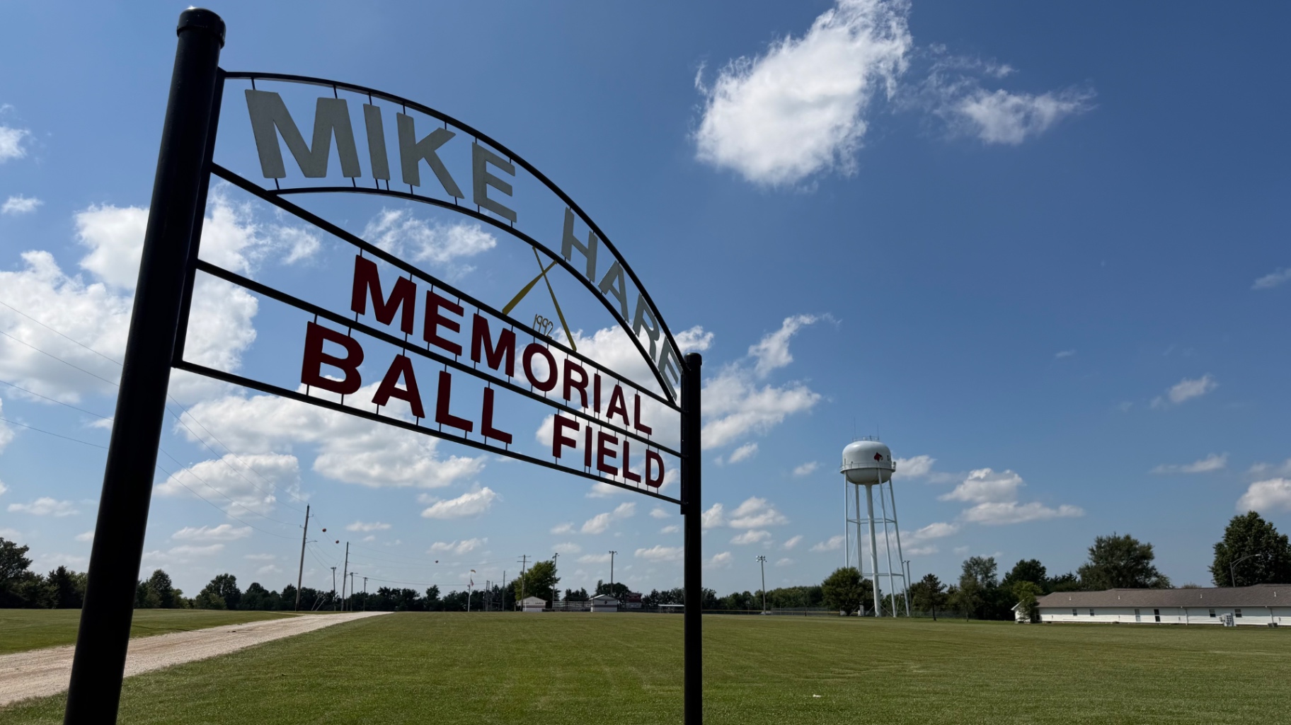Mike Hare Memorial Ball Field sign with water tower