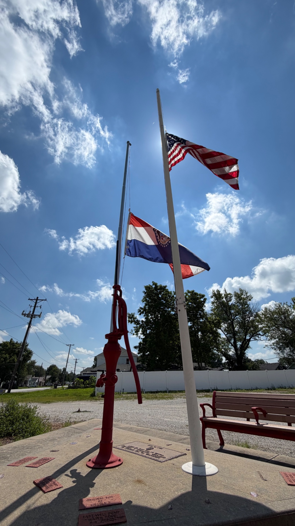Old Pump Memorial with American and Missouri flags