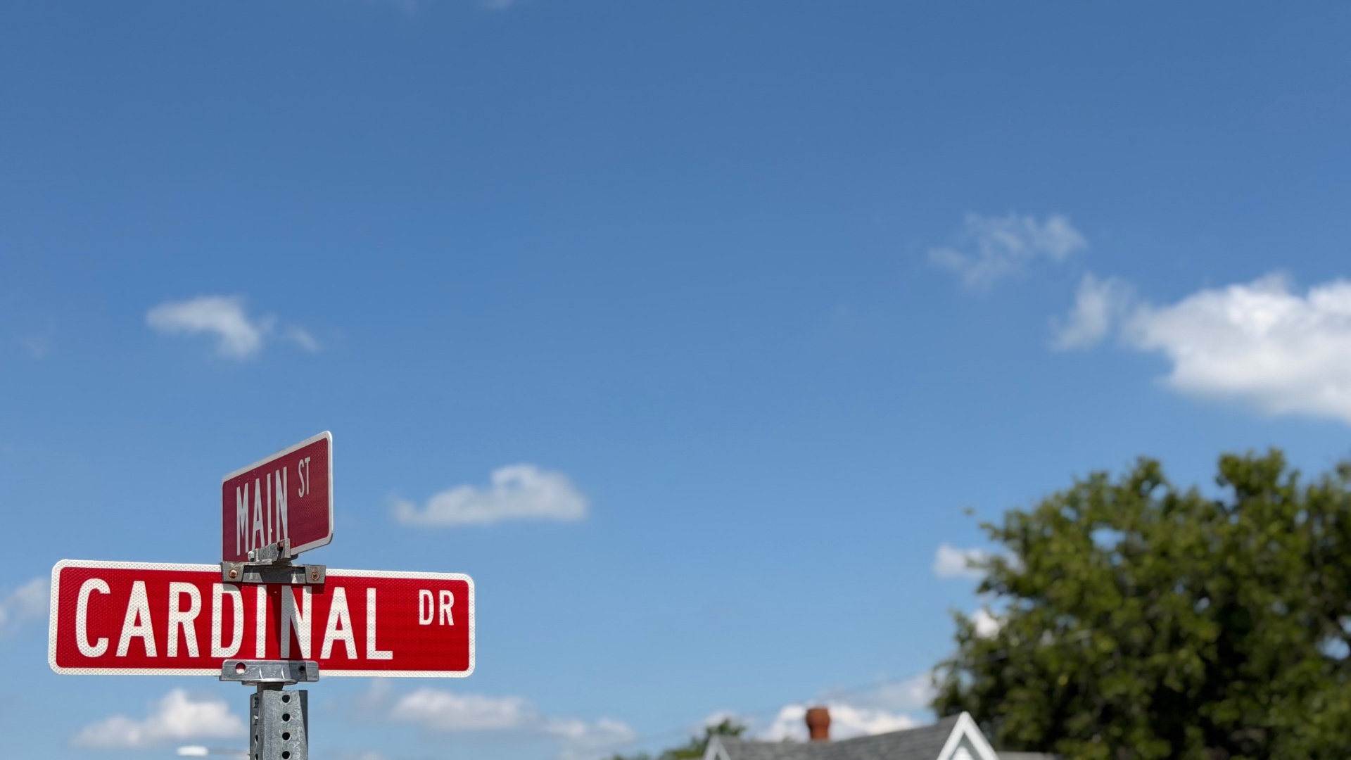 Main Street and Cardinal Drive street signs in Lincoln, MO